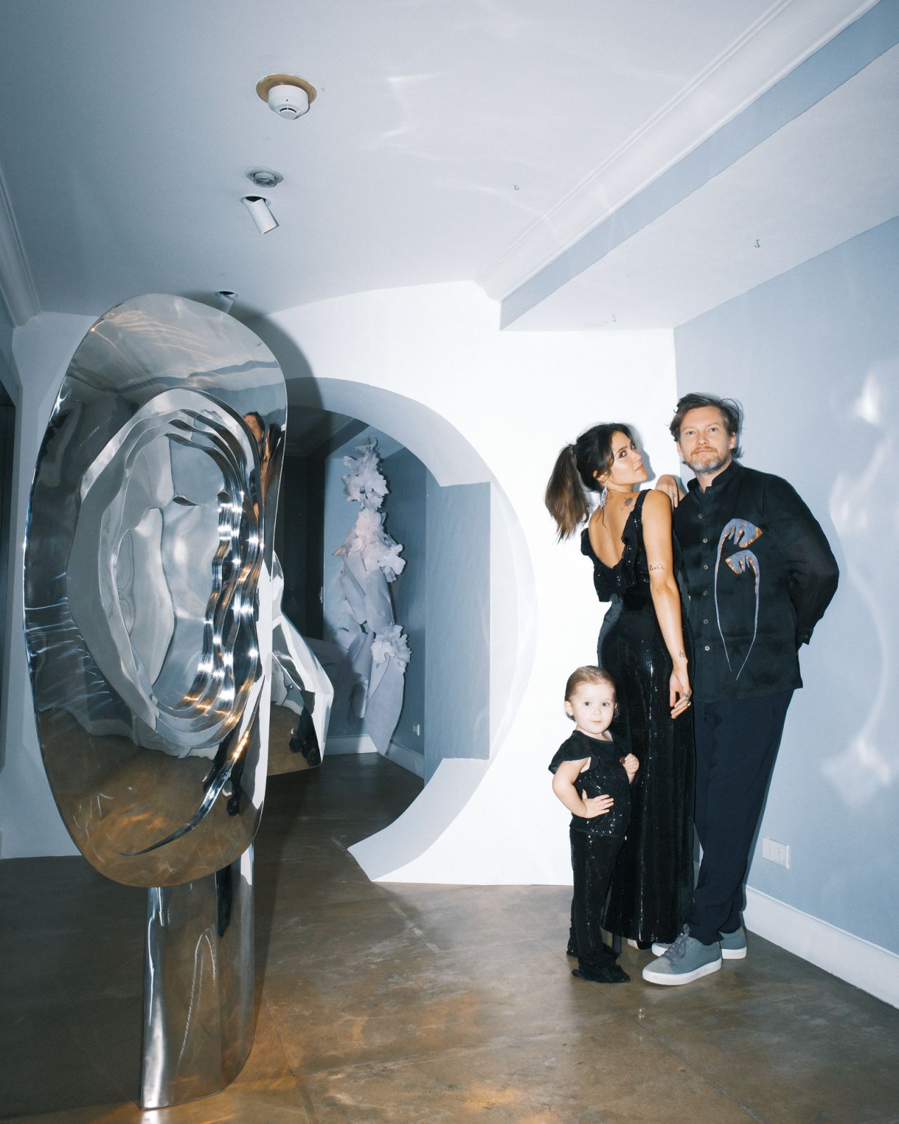 Kifu Augousti poses for a family portrait with her husband, Patrick Coard and daughter River