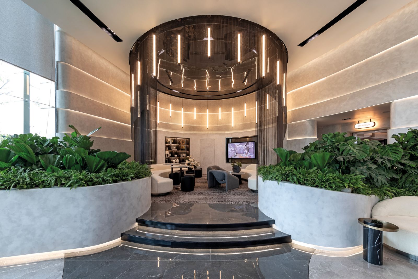 The standout feature of the Lumi showroom is a cove-like sitting area with carefully curated lighting fixtures