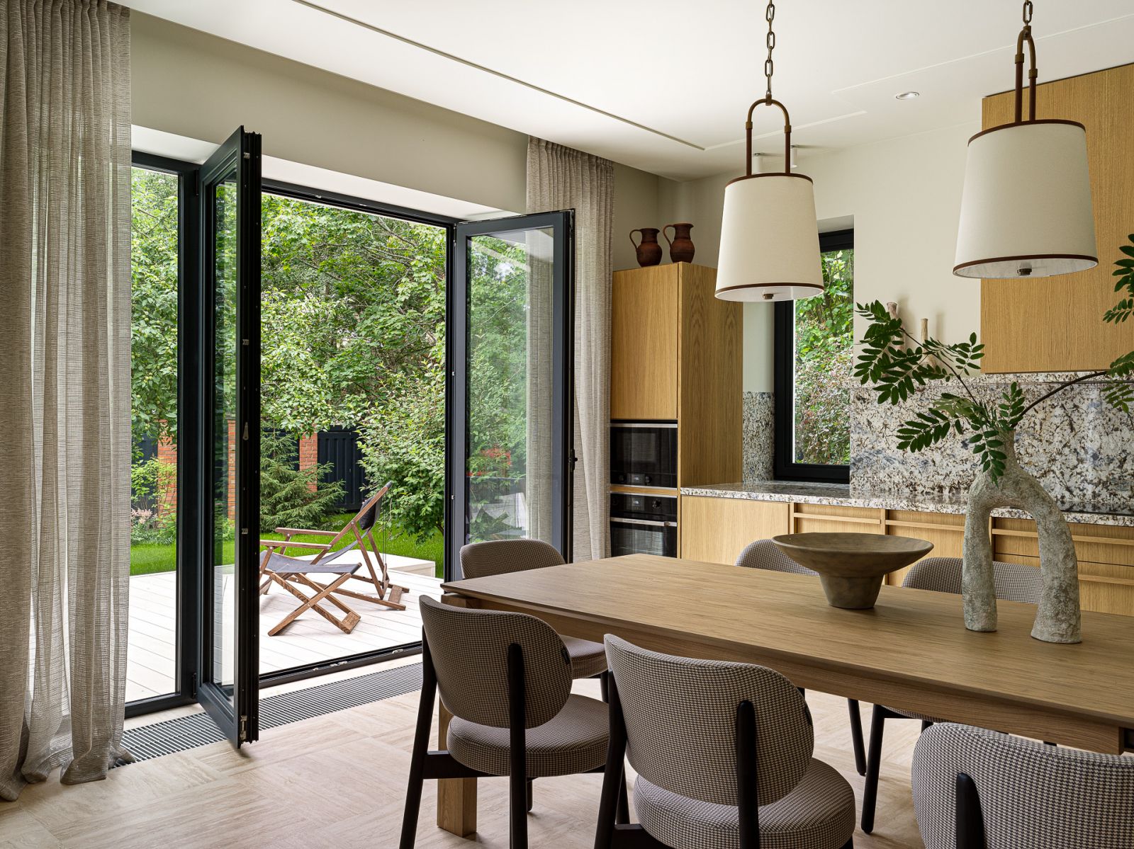 Glass-panelled doors open into the terrace