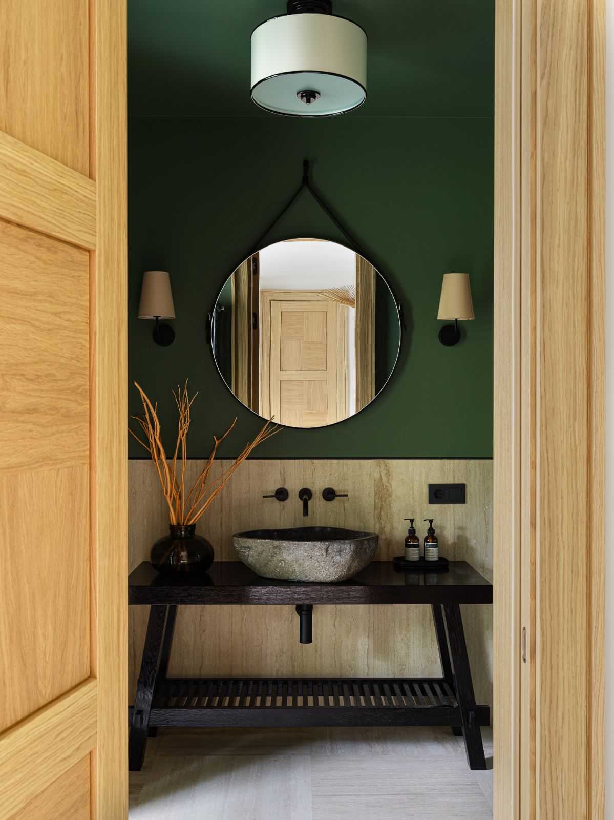 Rich green adds vibrancy to the guest bathroom