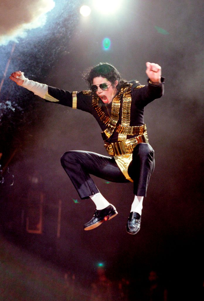 UNITED KINGDOM - JANUARY 01:  WEMBLEY STADIUM  Photo of Michael JACKSON, Michael Jackson performing on stage, jumping in the air - Dangerous Tour  (Photo by Phil Dent/Redferns)