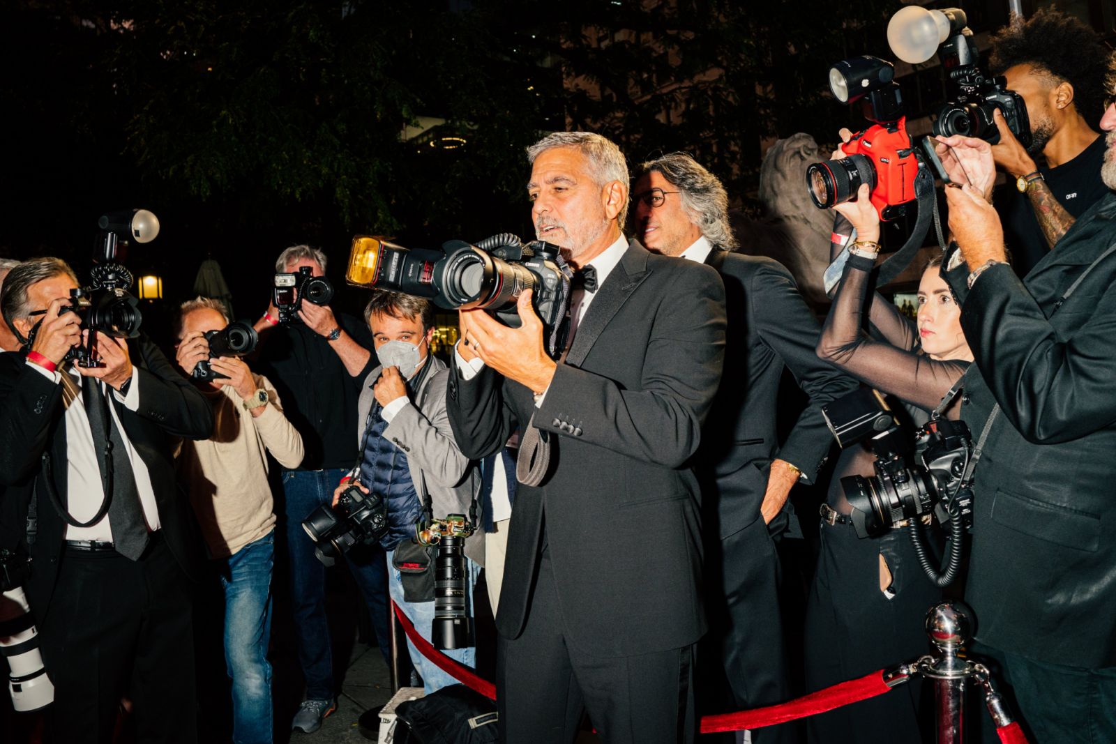 George Clooney is holding a camera at Clooney Foundation For Justice Inaugural Albie Awards