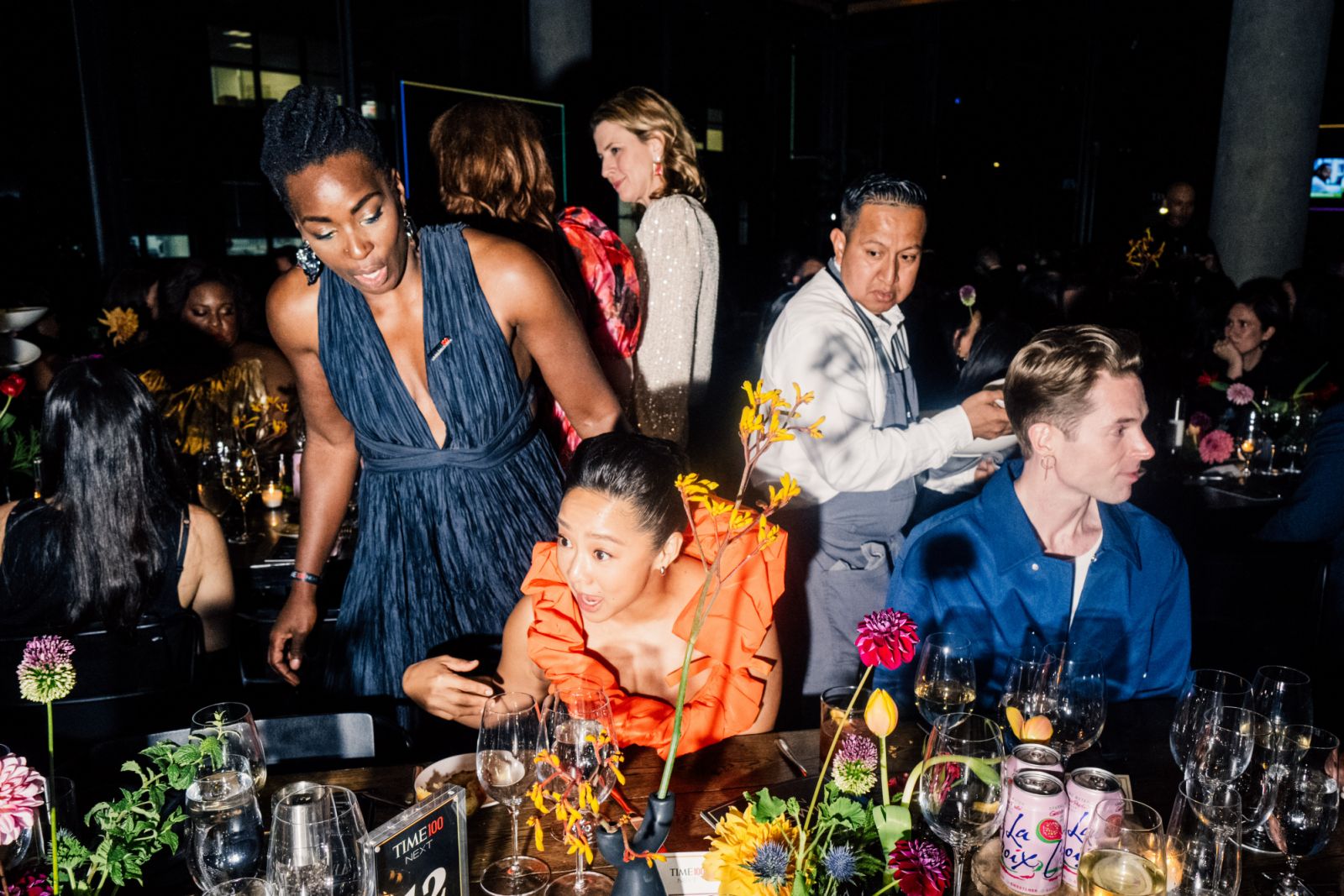 Stephanie Hsu, an American actress, sits at a dinner table at TIME100 Next Gala