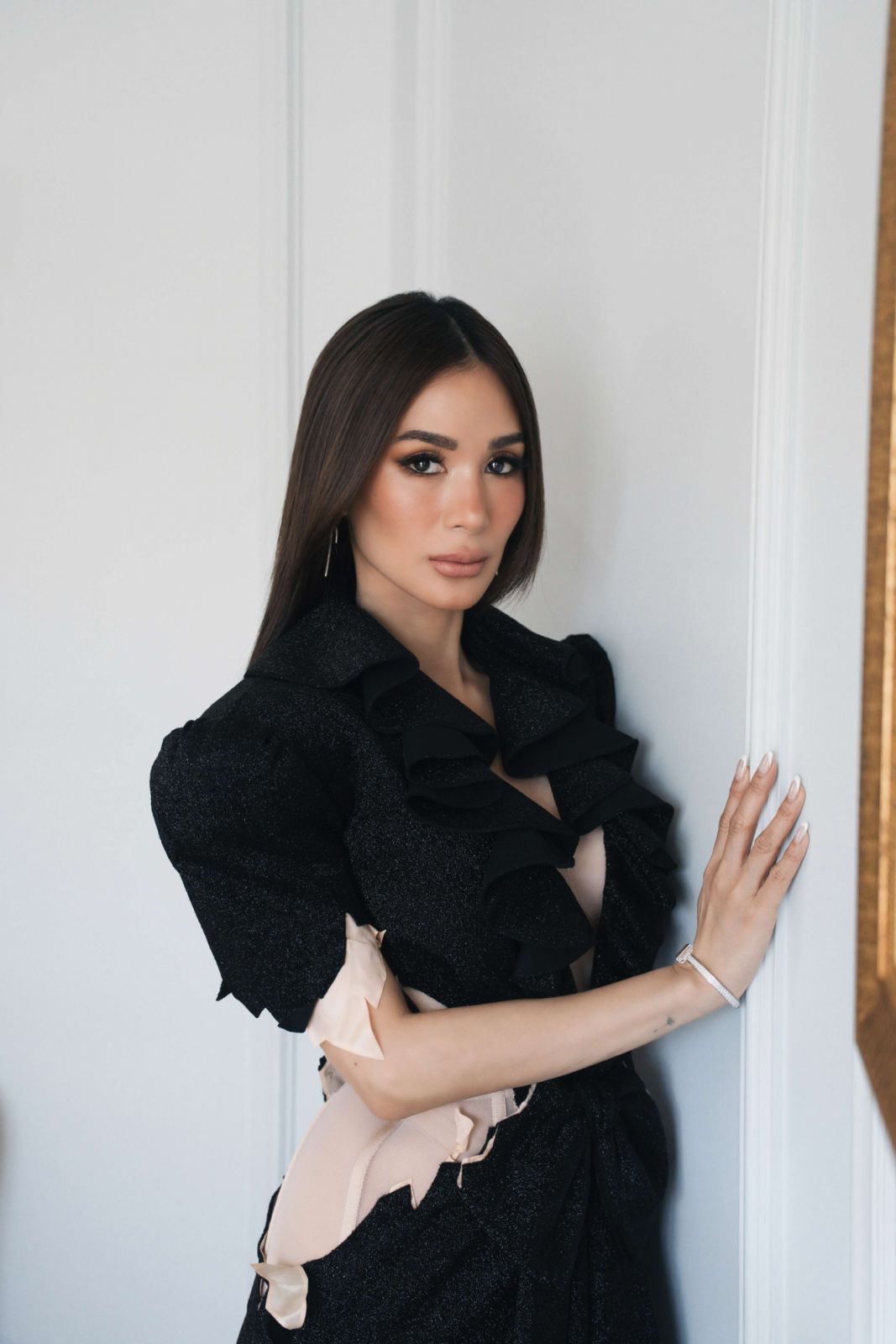 Evangelista wears Viktor and Rolf gown, Tiffany & Co Tiffany Knot earrings and Tiffany T T1 wide diamond bangle