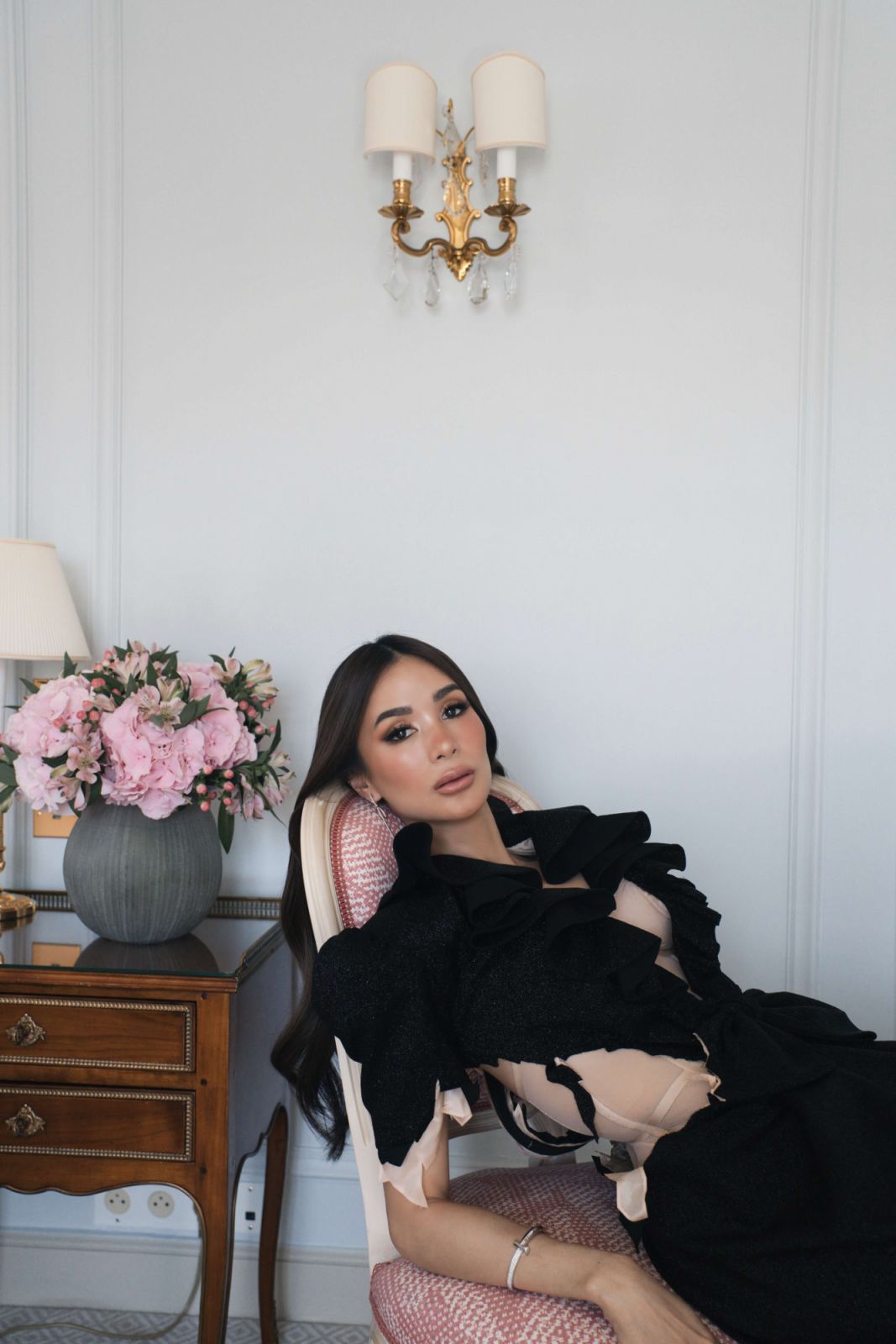 Evangelista wears Viktor and Rolf gown, Tiffany & Co Tiffany Knot earrings and Tiffany T T1 wide diamond bangle