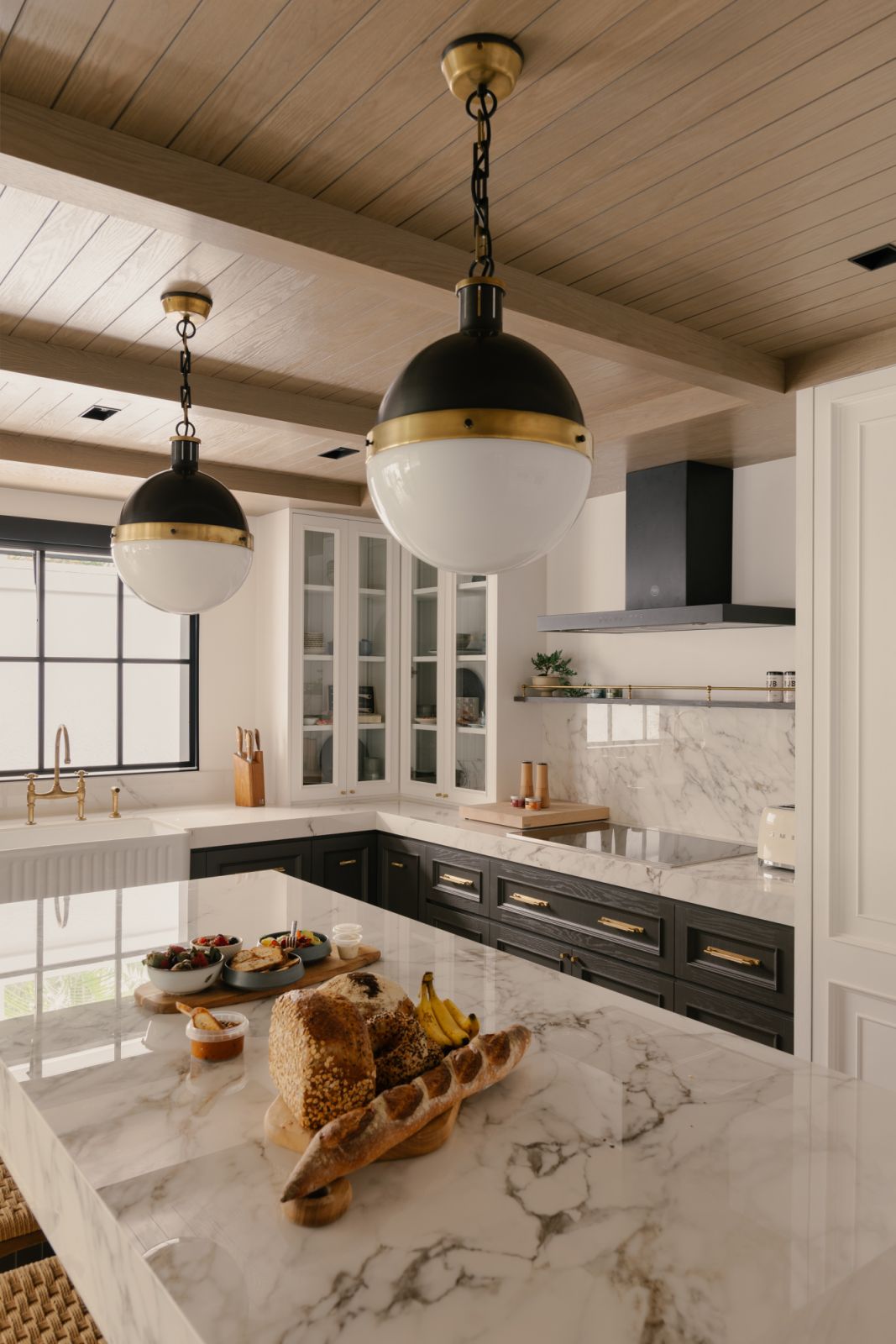 Glossy countertops lend a luxurious feel to the kitchen