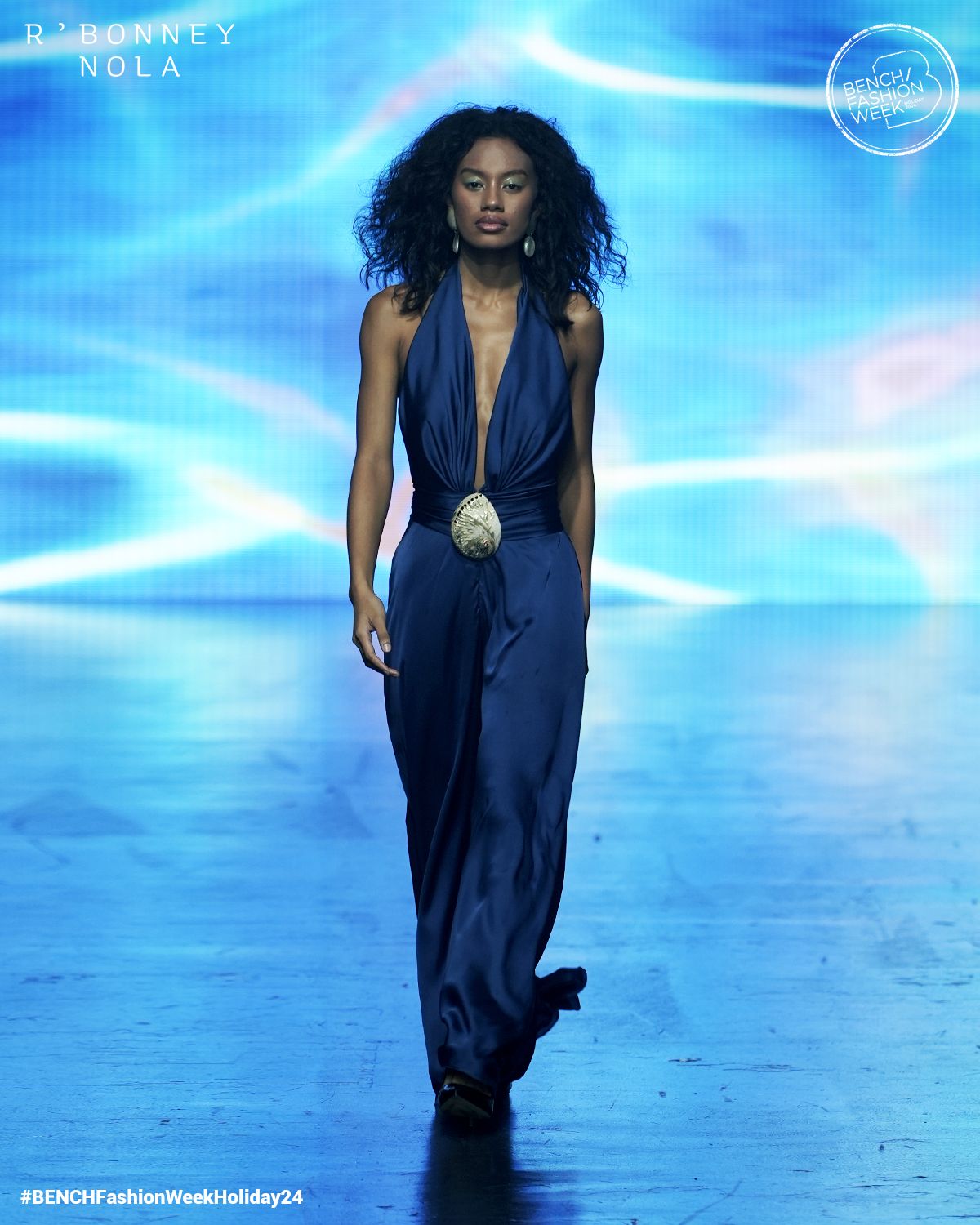 A model wears a deep blue ensemble by R'Bonney Nola Gabriel (Photo: Bench)