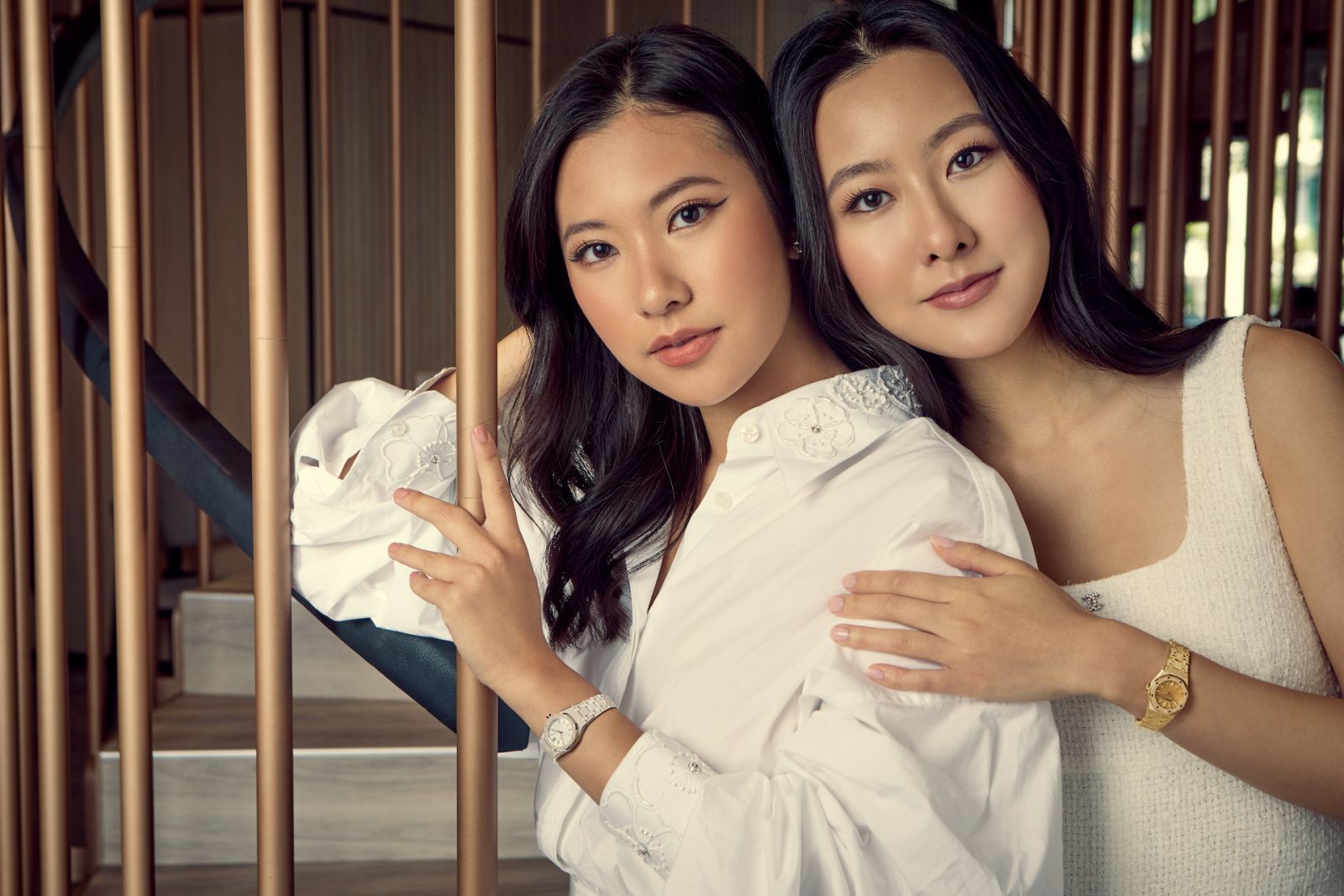 Rachel Yeoh wears Audemars Piguet Royal Oak Mini in white gold and D&G dress; Michelle Yeoh wears the Audemars Piguet Royal Oak Mini in yellow gold and her own outfit