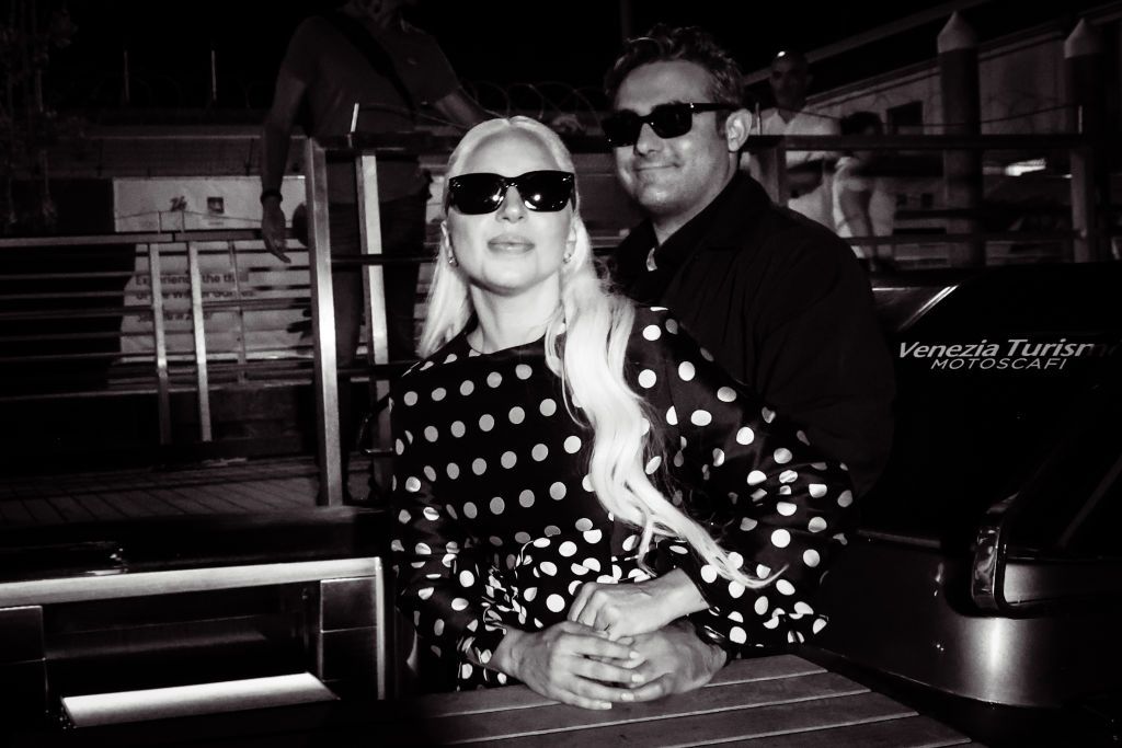 VENICE, ITALY - SEPTEMBER 02: (EDITOR'S NOTE: Image has been converted to black and white). Lady Gaga and Michael Polansky are seen arriving at the Venice's airport during the 81st Venice International Film Festival at on September 02, 2024 in Venice, Italy. (Photo by Franco Origlia/Getty Images)