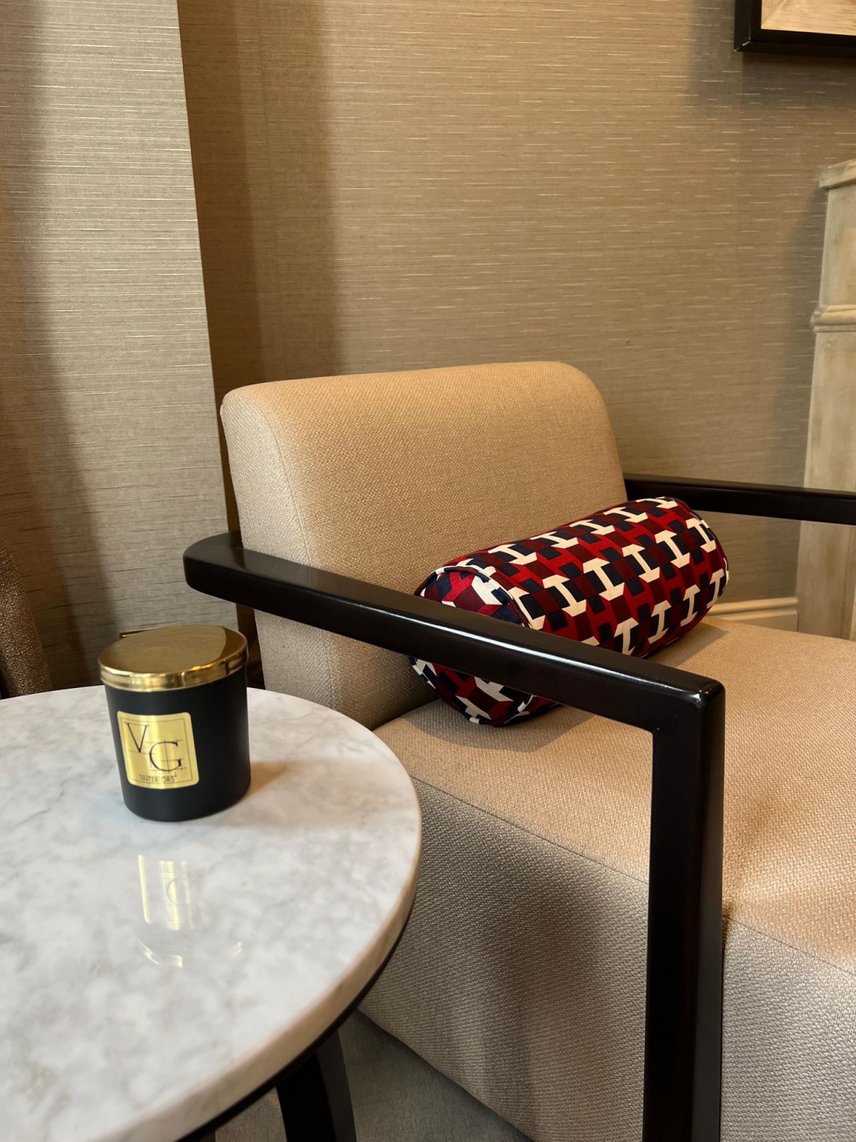 A Victor Gradinaru Interiors bespoke armchair design and limited-edition hand-poured candle