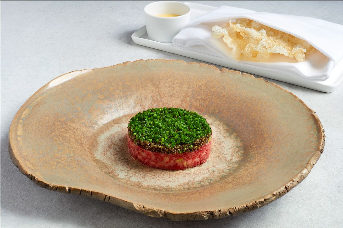 Stone Axe wagyu tartare with asparagus, Hollandaise and beef tendon