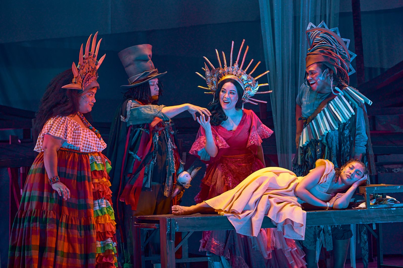 Radha as Asaka, Lorenz Martinez as Papa Ge, Shiela Valderrama-Martinez as Erzulie and Garrett Bolden as Agwe