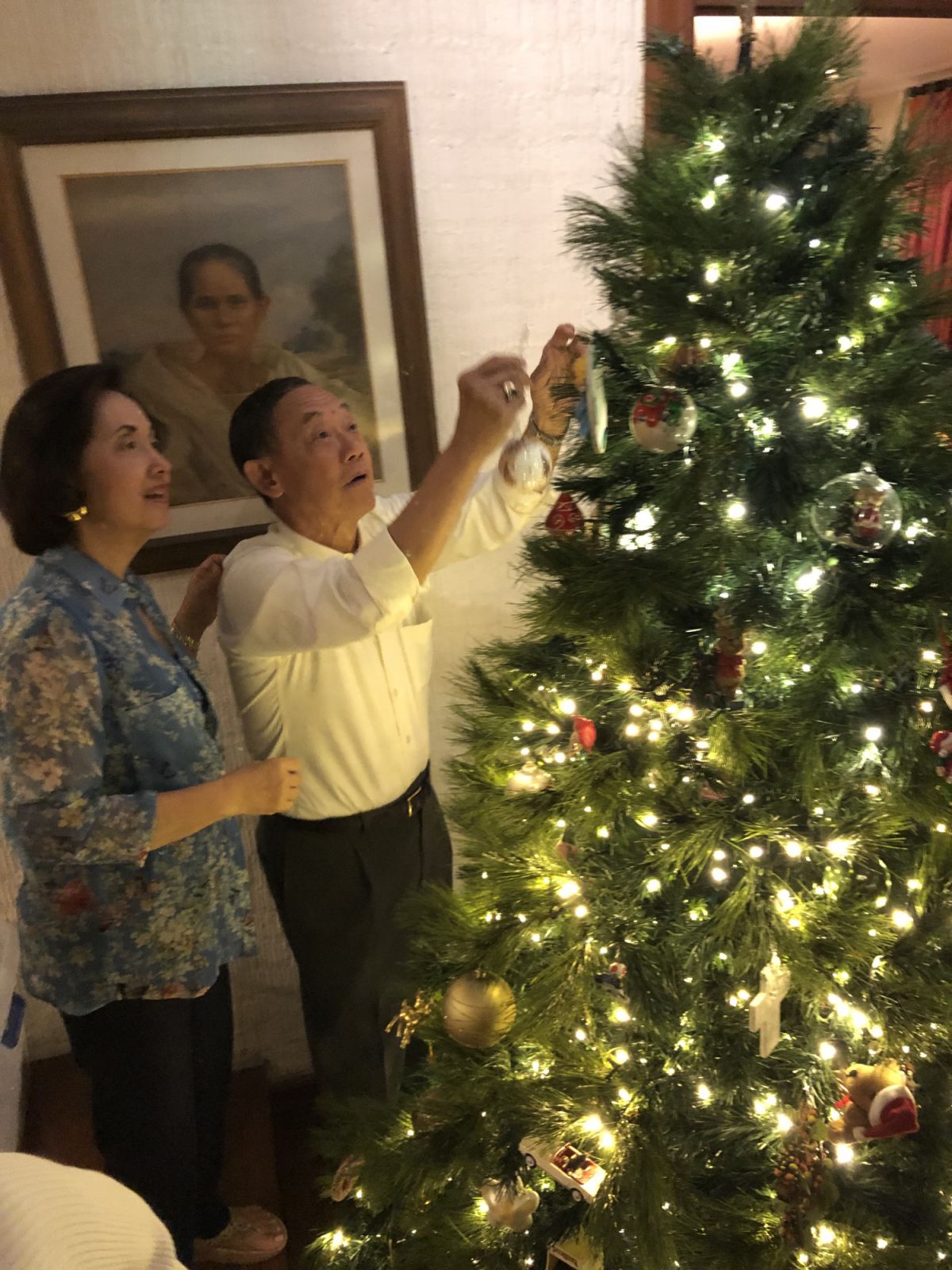 Jose Mari Chan and his wife, Mary Ann Ansaldo decorating the Christmas tree