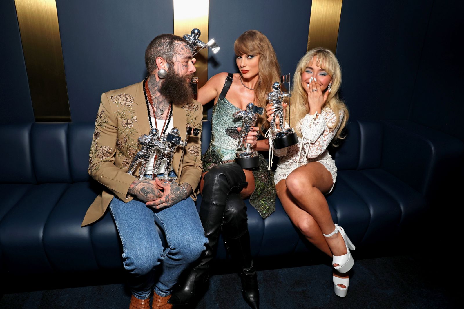 ELMONT, NEW YORK - SEPTEMBER 11: (L-R) Post Malone, Taylor Swift and Sabrina Carpenter on stage during the 2024 MTV Video Music Awards at UBS Arena on September 11, 2024 in Elmont, New York.  (Photo by Kevin Mazur/Getty Images for MTV)