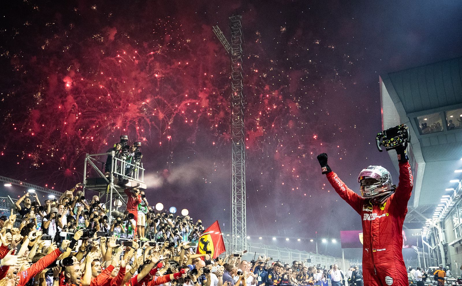 SINGAPORE, SINGAPORE - SEPTEMBER 22: Race winner Sebastian Vettel of Germany and Ferrari celebrates in parc ferme during the F1 Grand Prix of Singapore at Marina Bay Street Circuit on September 22, 2019 in Singapore. (Photo by Lars Baron/Getty Images)