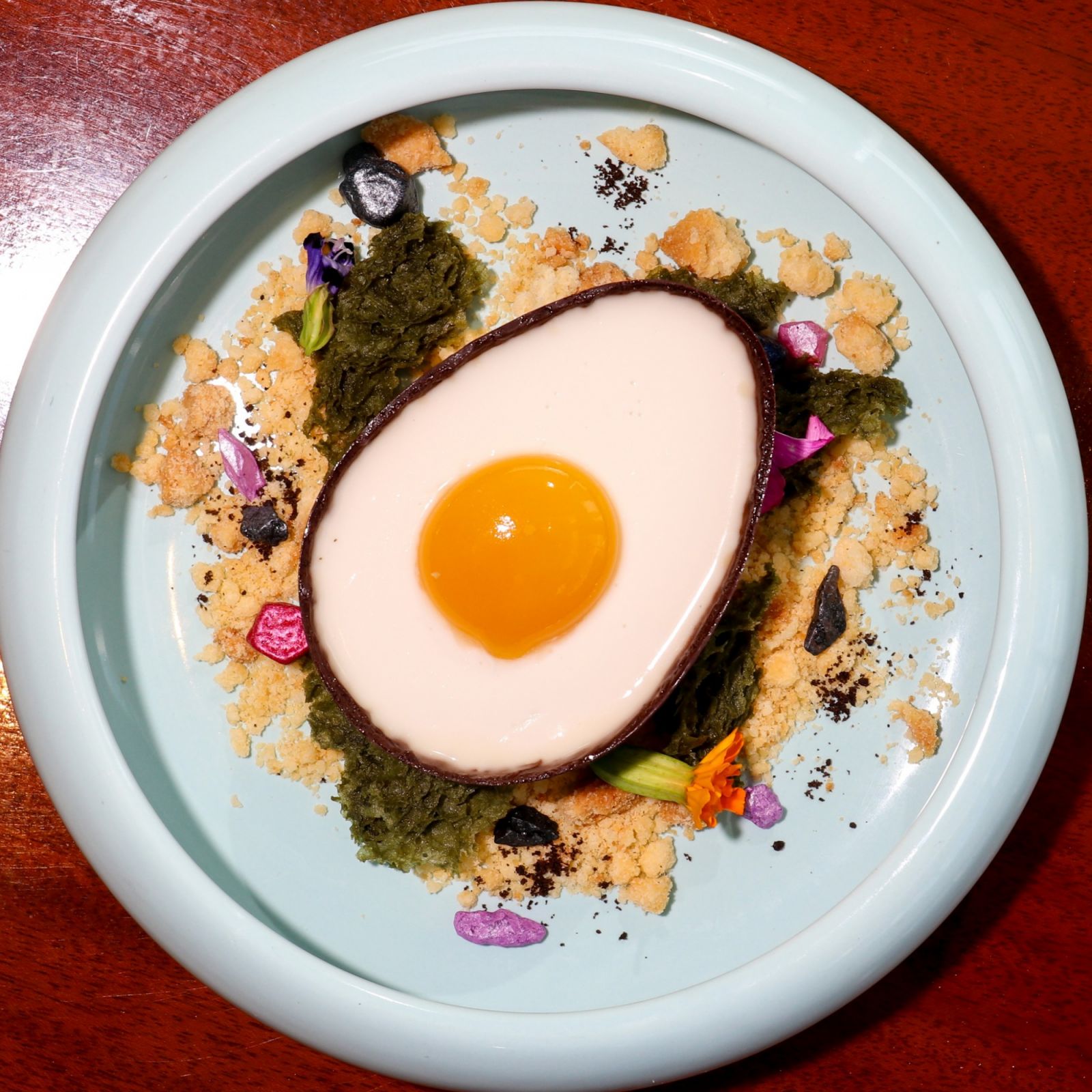 creamy Coconut Mousse with a Mango Puree ‘Yolk’ in the centre from chef Jereme Leung's 'The Emperor's Table'