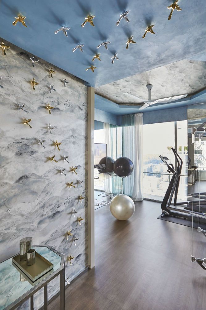 A glamorous fitness area in a Singapore apartment by Design Intervention