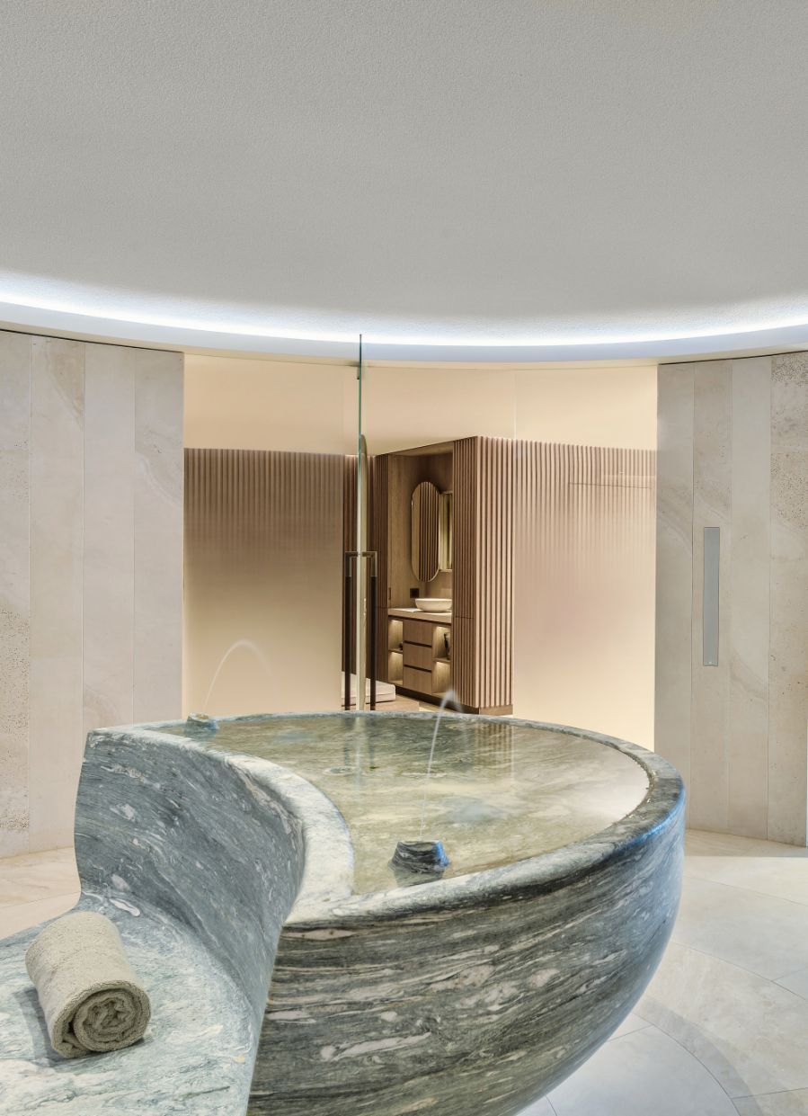 The entrance to the spa zone in this Swiss villa was fitted with a calming fountain
