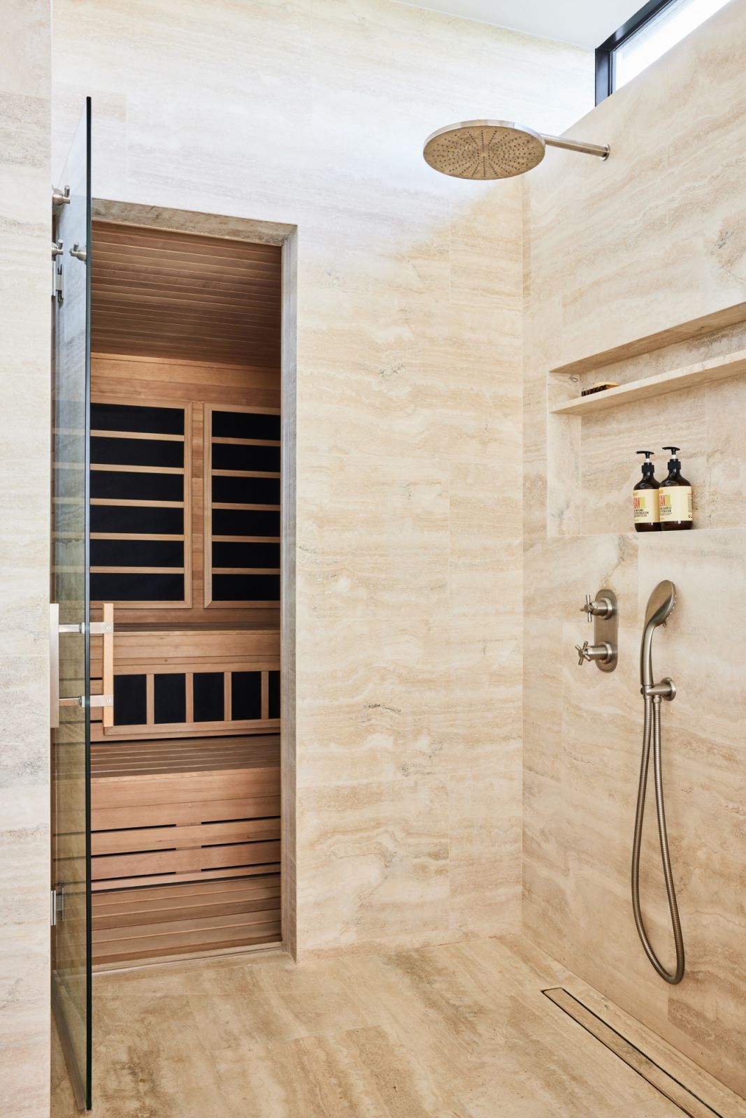 A soothing rain shower with a built-in sauna, spotted inside a Miami home designed by Evan Edward