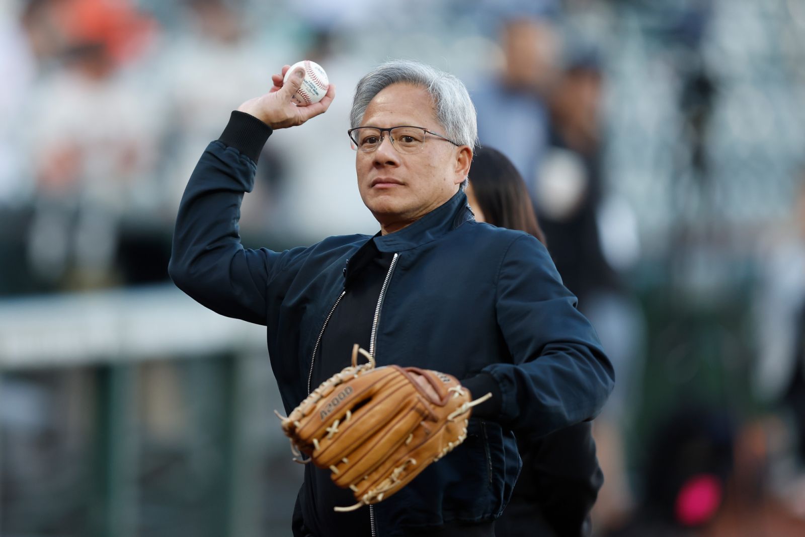 SAN FRANCISCO, CALIFORNIA - SEPTEMBER 03: Jensen Huang CEO of NVIDIA prepares to throw out the ceremonial first pitch before the game between the San Francisco Giants and the Arizona Diamondbacks at Oracle Park on September 03, 2024 in San Francisco, California. (Photo by Lachlan Cunningham/Getty Images)