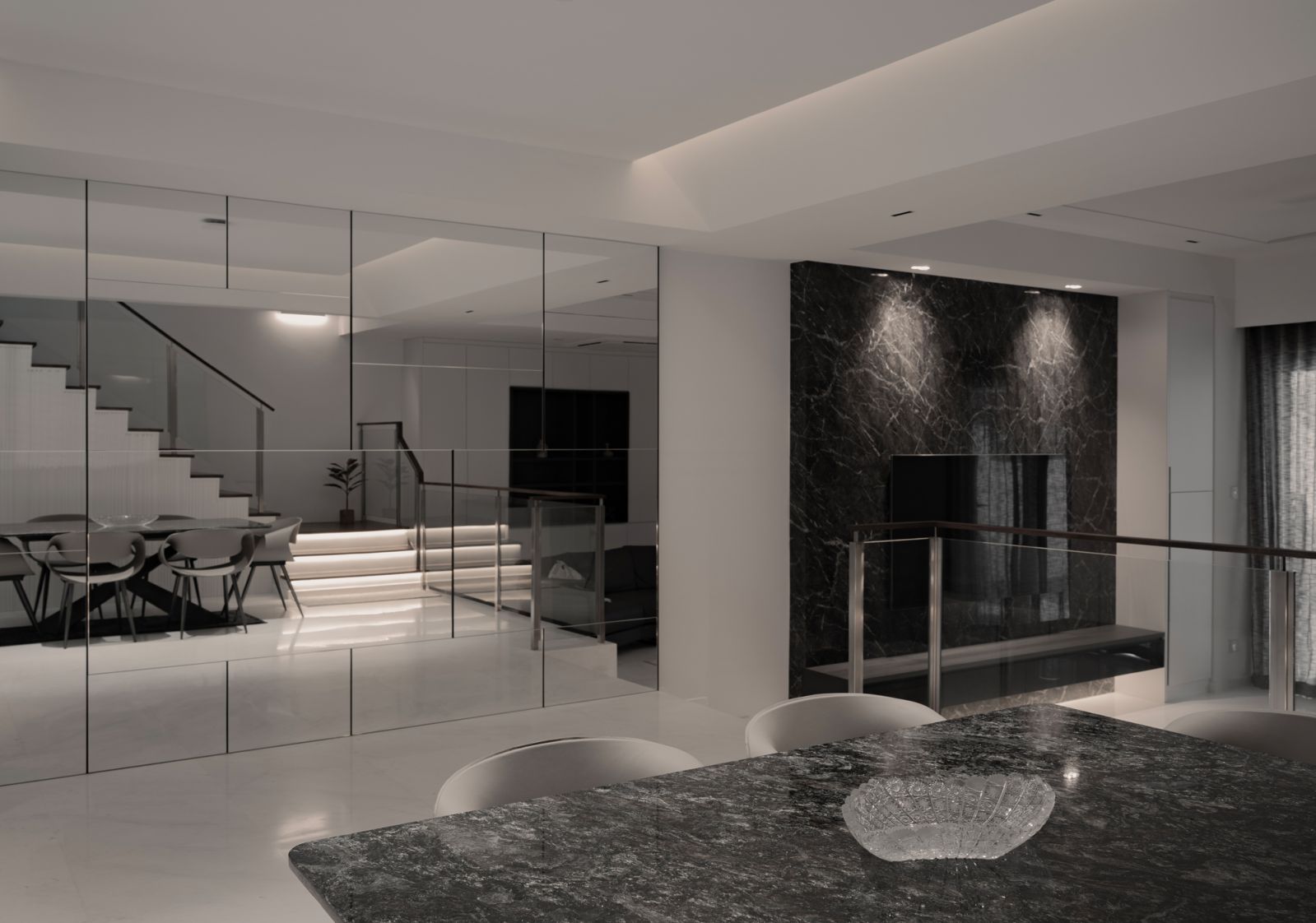 The monochromatic palette enhances the open-plan interiors in this inter-terrace house at Changi, designed by Jia Studios