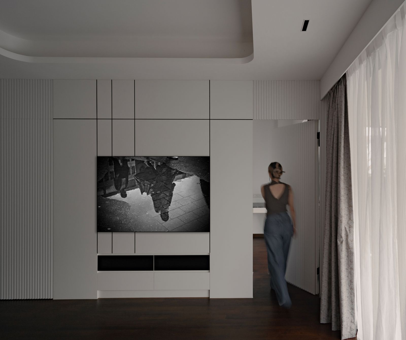 Hidden entrances keep the finishes throughout the Changi home sleek and streamlined
