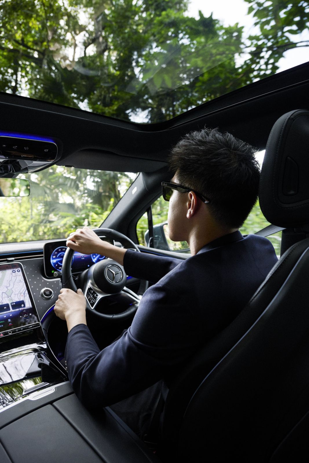 Siu drives the Mercedes-Benz EQE SUV on Barker Road at Hong Kong’s Victoria Peak (Photo: Zed Leets/Tatler Hong Kong)