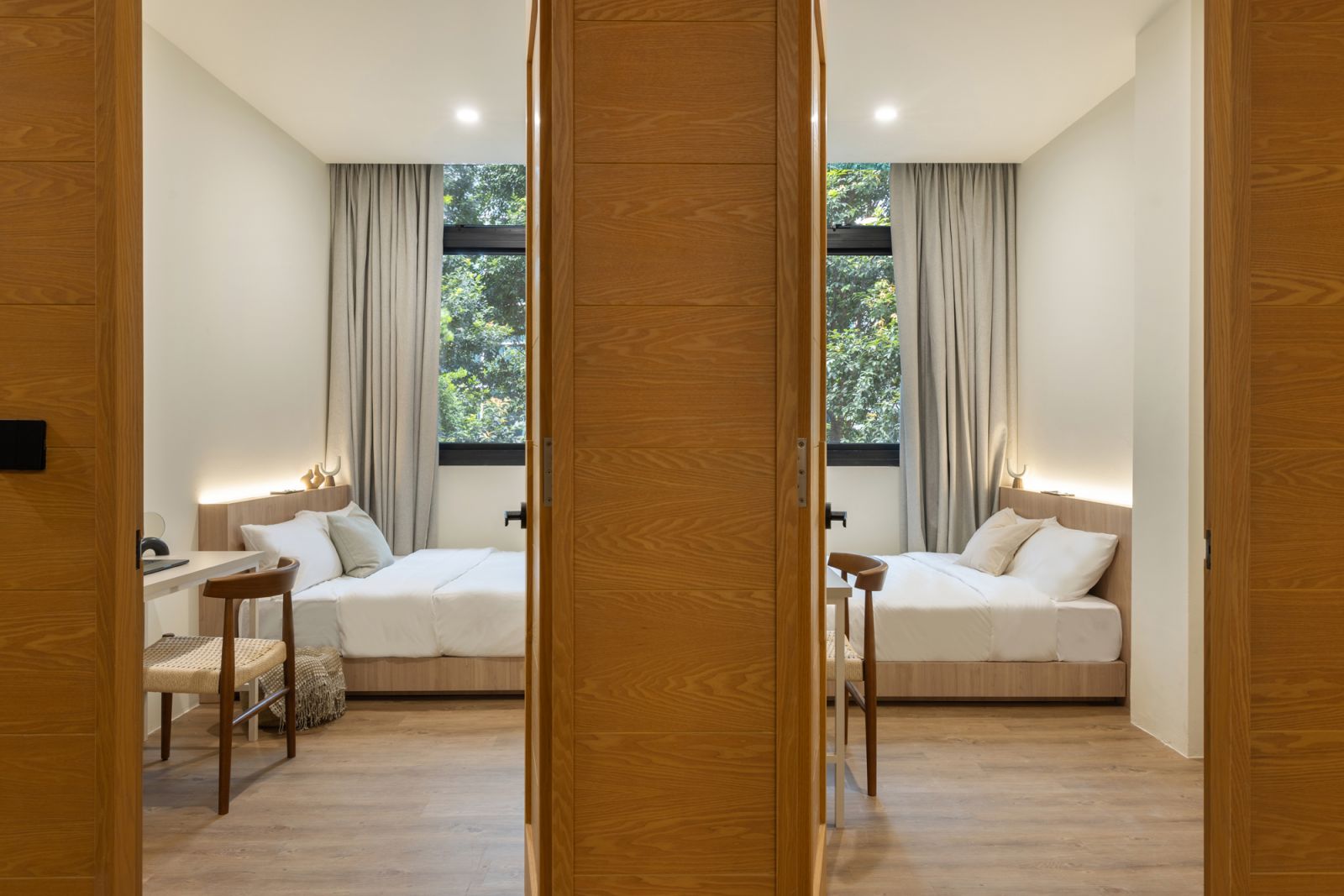 The adjacent bedrooms in the Alma House Family Suite