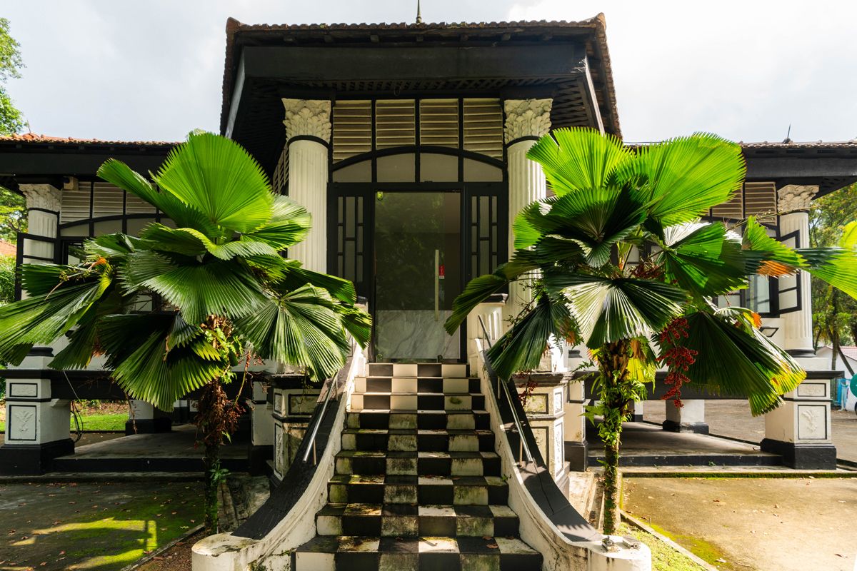 The stately entrance of the black-and-white house at 31 Scotts Road