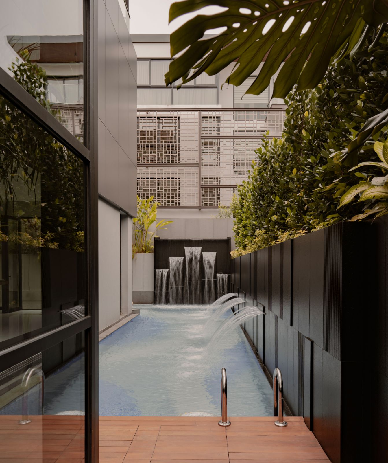 The pool area turns the outdoors of the Holland Grove home into an oasis