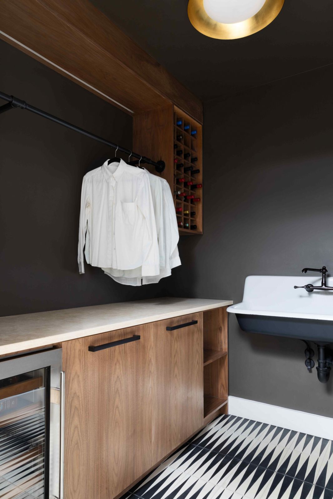 The laundry room that doubles as a wine storage area