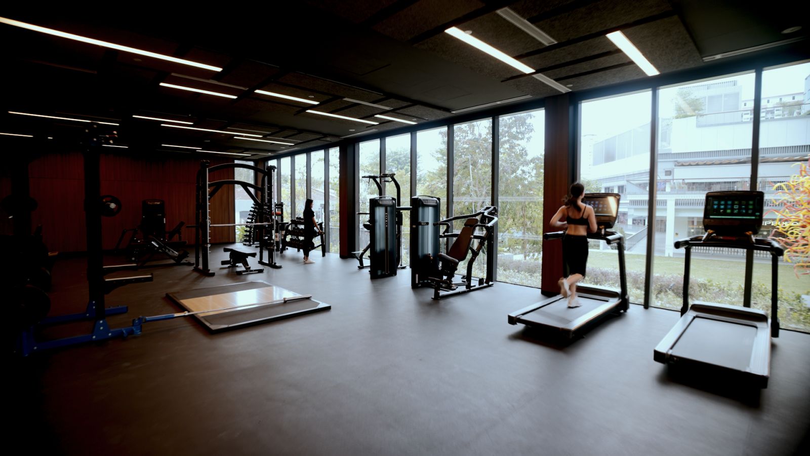 The fitness centre is well-equipped and brightly lit for a productive workout