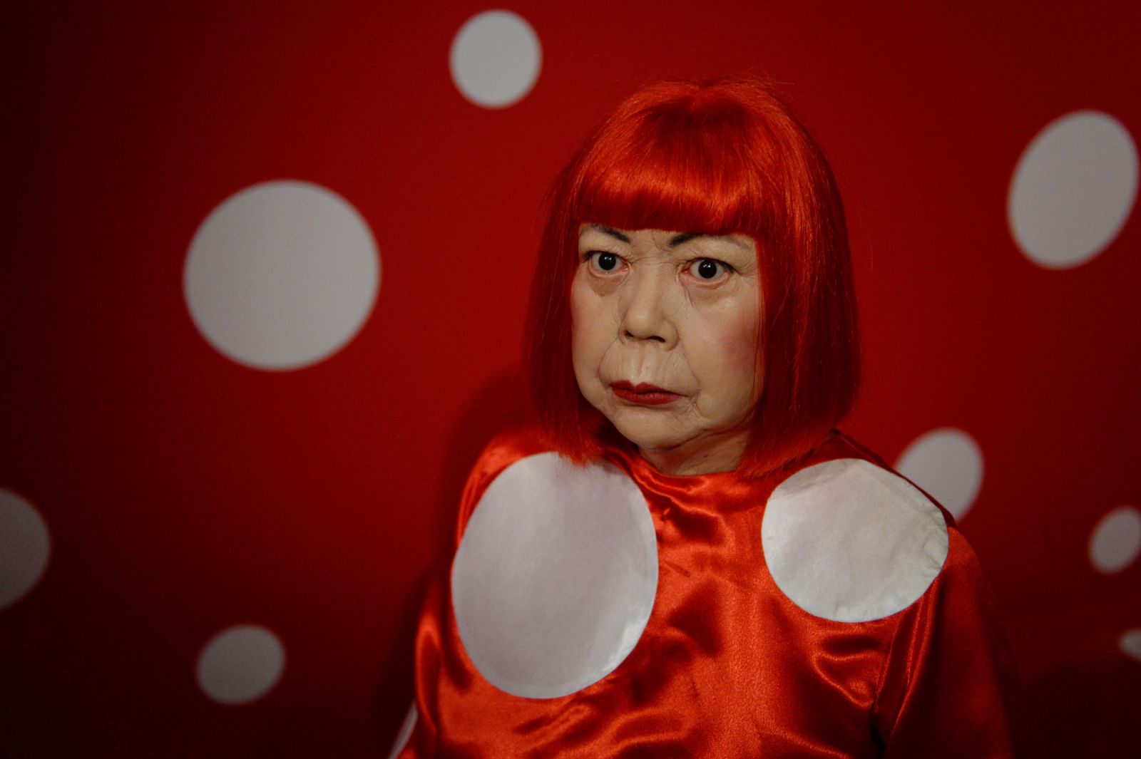 TOKYO, JAPAN - MAY 16:  A wax figure of Japanese artist Yayoi Kusama is displayed at the Madame Tussauds Tokyo on May 16, 2016 in Tokyo, Japan. Madame Tussauds wax museum in Tokyo's latest attraction let visitors, or their holograms, waltz with Leonardo DiCaprio, dance with Beyonce or take part in 'Swan Lake.'  (Photo by Takashi Aoyama/Getty Images)