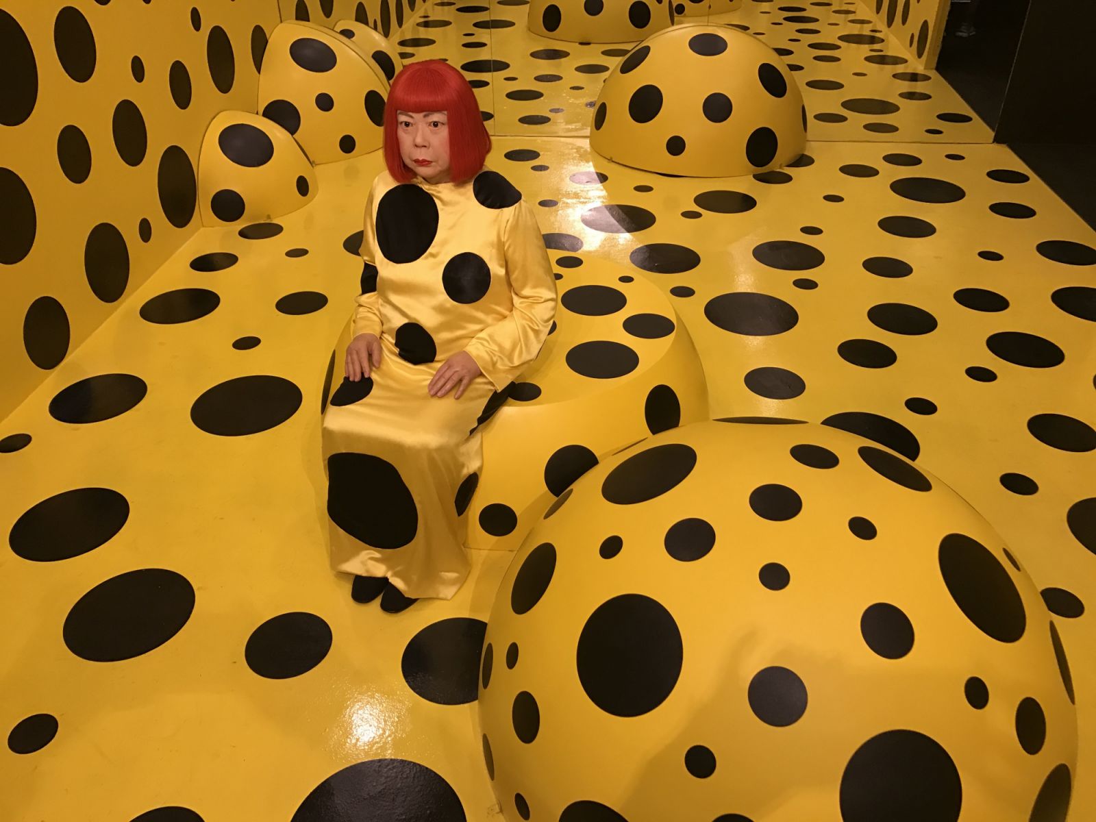 HONG KONG - NOVEMBER 02:  The wax figure of Japanese artist Yayoi Kusama is surrounded by the polka dots at Madame Tussauds Hong Kong on November 2, 2016 in Hong Kong, China.  (Photo by Visual China Group via Getty Images/Visual China Group via Getty Images)