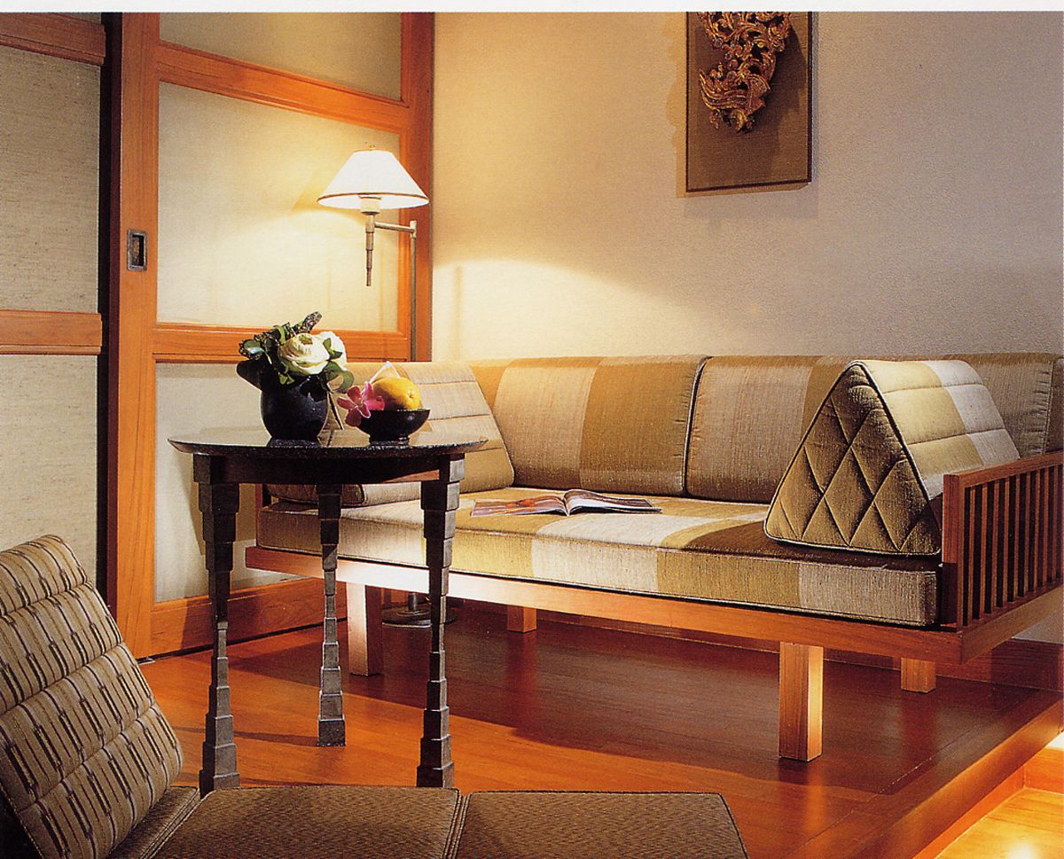 The daybed at Sukhotai Bangkok incorporates the traditional Thai triangle cushion