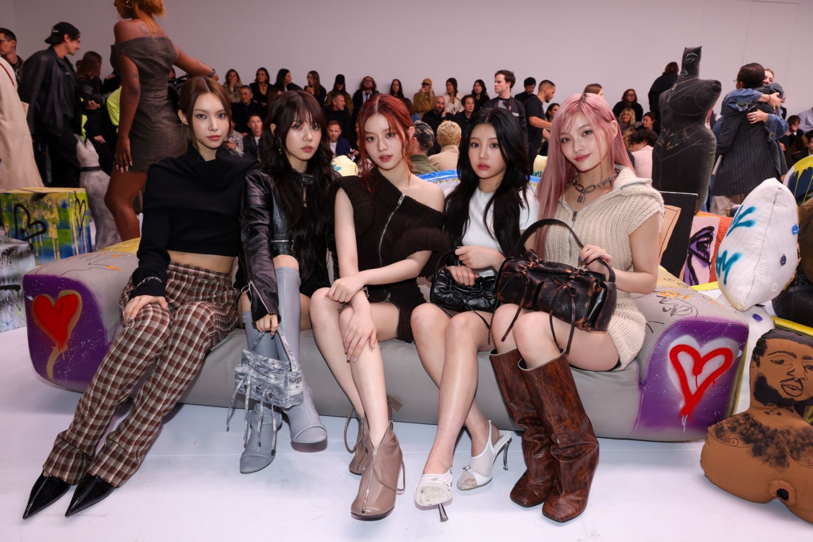 PARIS, FRANCE - SEPTEMBER 25: (EDITORIAL USE ONLY - For Non-Editorial use please seek approval from Fashion House) (L-R) Yunah, Moka, Minju, Wonhee and Iroha of I'LL-IT band attends the Acne Studios Womenswear Spring-Summer 2025 show as part of Paris Fashion Week on September 25, 2024 in Paris, France. (Photo by Peter White/Getty Images)