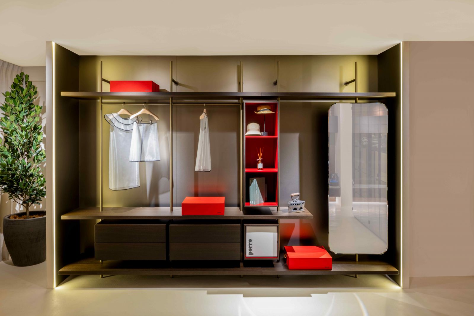 The Porro Boutique Mast dressing room in burnished brass, heat treated oak and rosso cina lacquer (Photo: Bonnie Yap Photography)