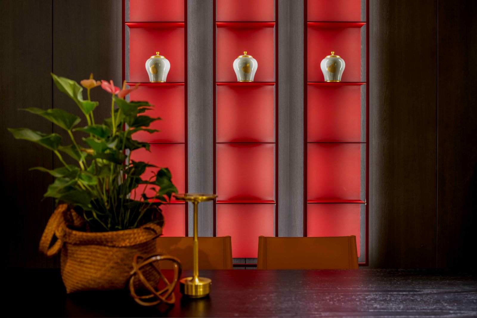 The Porro Gap hanging bookcases in precious rosso cina metal finish (Photo: Bonnie Yap Photography)