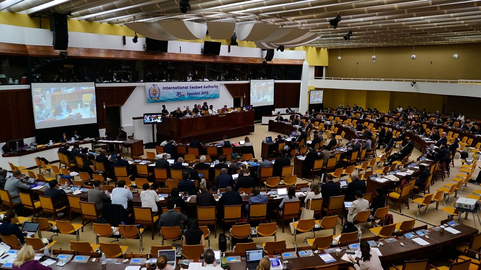 A movie still of an International Seabed Authority meeting