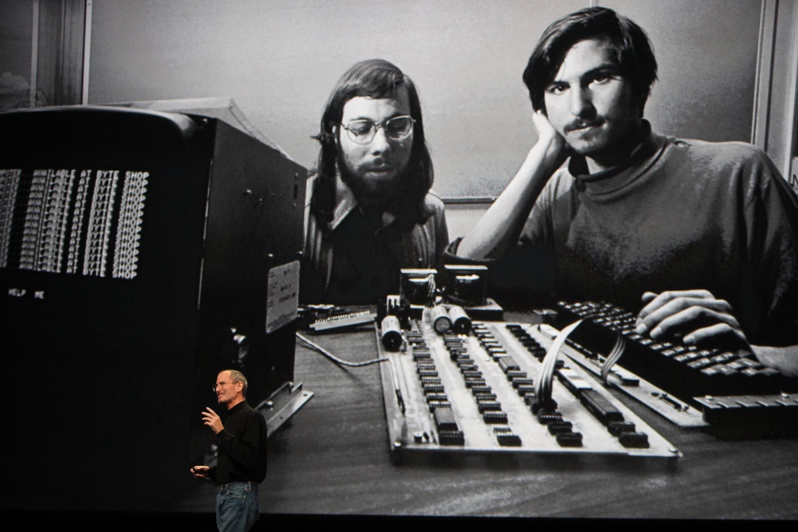 A photo of Steve Jobs and Steve Wozniak served as the backdrop while Jobs spoke at a conference in San Francisco (Photo: Getty Images)