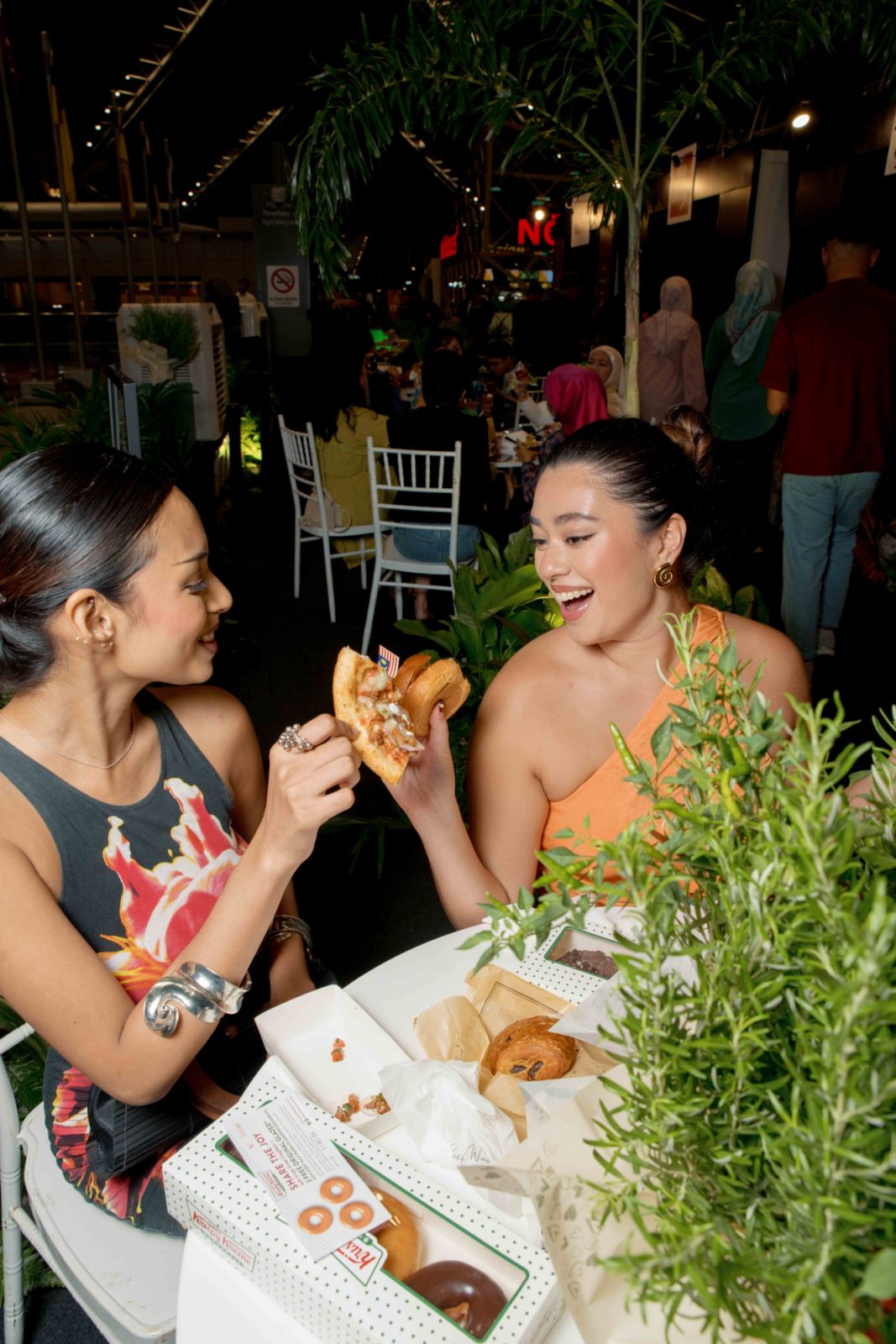 Guests sampling doughnuts and pizza
