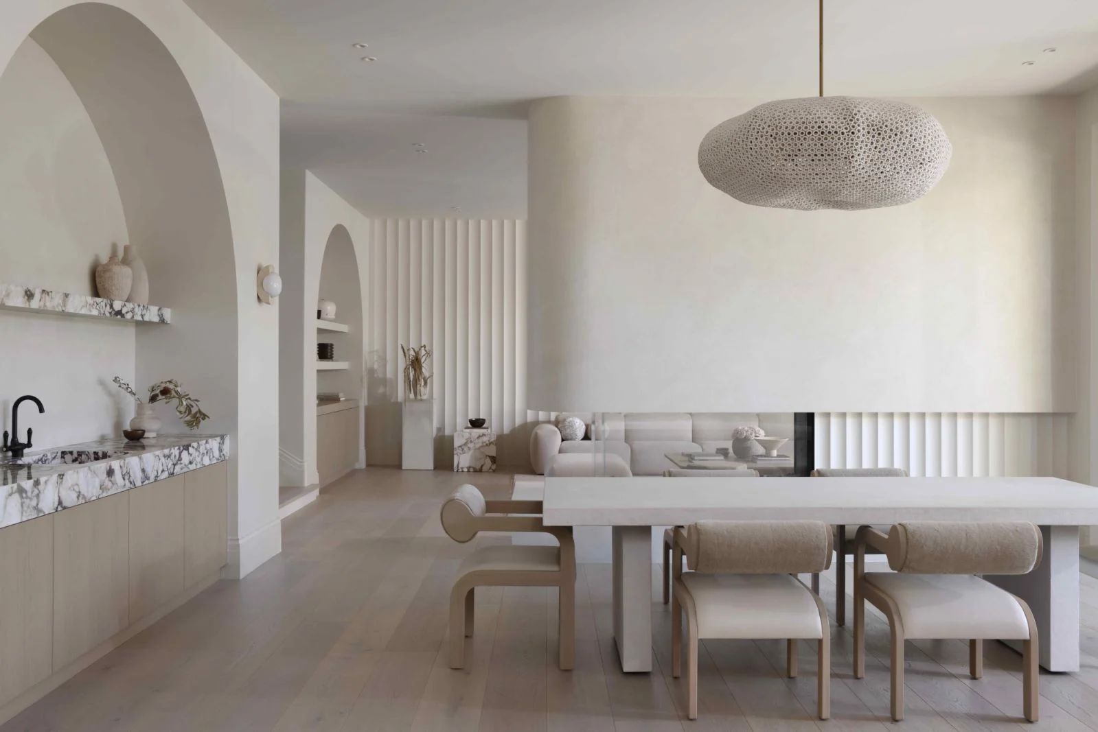 Interior designer Marianna Tomlenovich breaks up the open-plan layout with a uniquely designed fireplace (Photo: Ema Peter)