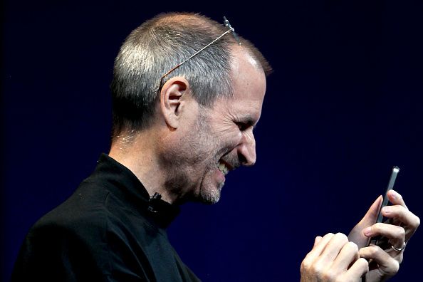 Steve Jobs, chief executive officer of Apple Inc., demonstrates the gyroscope functionality of the iPhone 4 during his keynote address at the Apple Worldwide Developers Conference (WWDC) in San Francisco, California, U.S., on Monday, June 7, 2010. Jobs introduced the redesigned iPhone 4 today, delivering a 24 percent thinner body and 100 new features. Photographer: David Paul Morris/Bloomberg via Getty Images