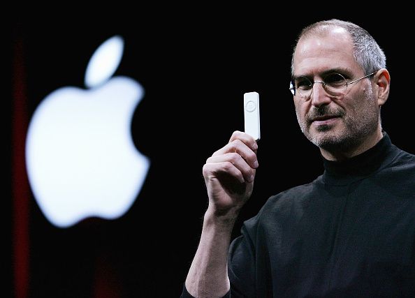 SAN FRANCISCO - JANUARY 11: Apple CEO Steve Jobs holds a new iPod shuffle MP3 player at the 2005 Macworld Expo January 11, 2005 in San Francisco, California. Jobs announced several new products including the new Mac Mini personal computer starting at $499 and the iPod shuffle MP3 player for $99. (Photo by Justin Sullivan/Getty Images)