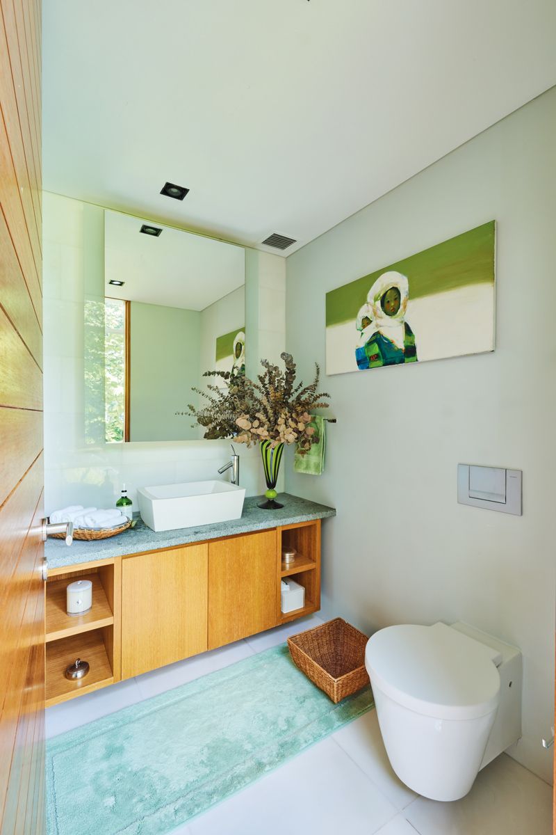 The home’s colour story also extends to the bathrooms