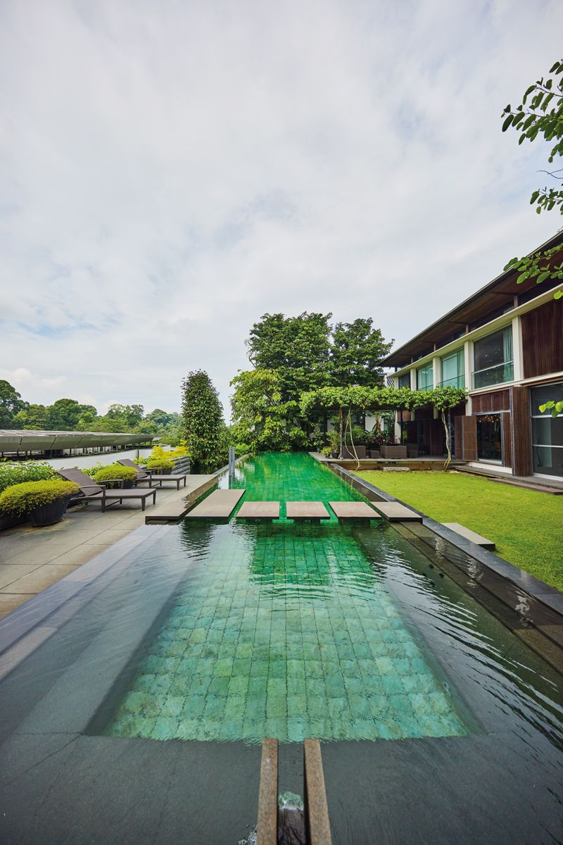 The resort-like backyard is a relaxing extension of the home ideal for outdoor gatherings , not pictured here are the Good Class Bungalow's 202 roof solar panels that generate 9000 KWh per month with predicted of payback is 4.5 years