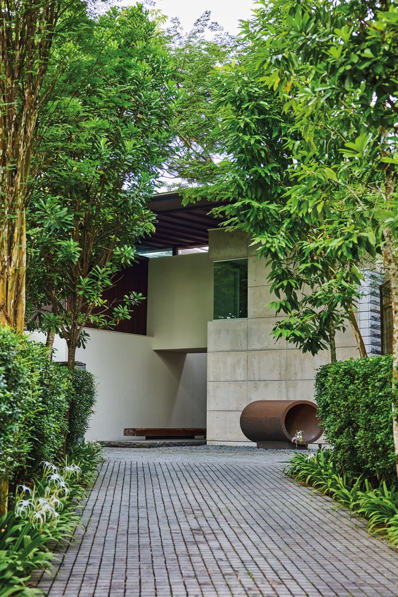 The Good Class Bungalow seen from the driveway, featuring Sun Yu-Li’s copper-tube sculpture