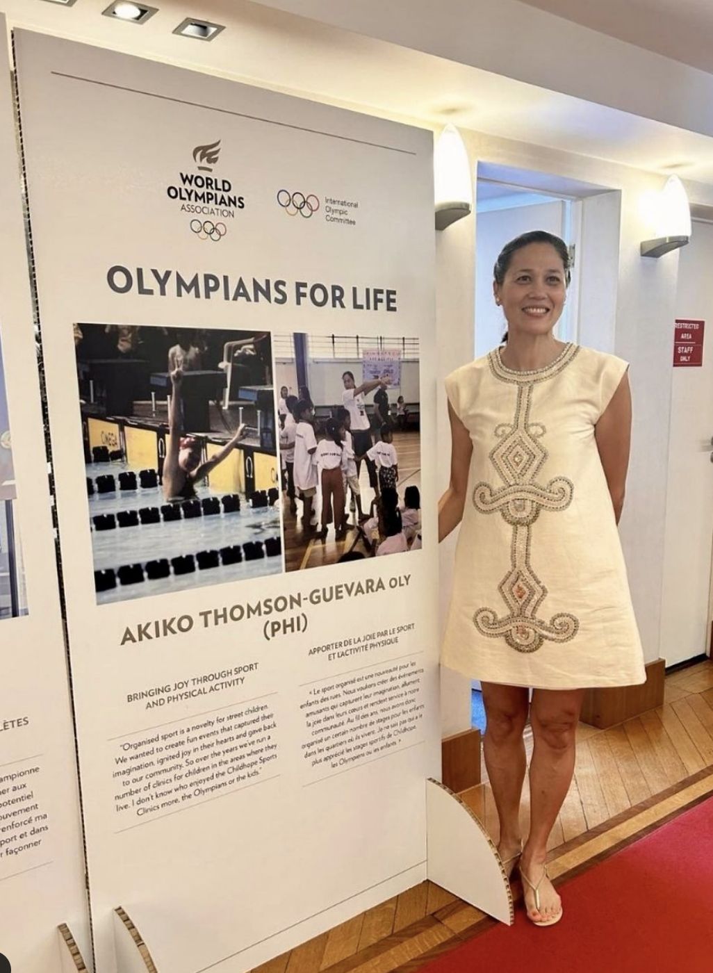 Three-time Olympian Akiko Thomson-Guevara posing with her accomplishments (Photo: Julia Fontana)