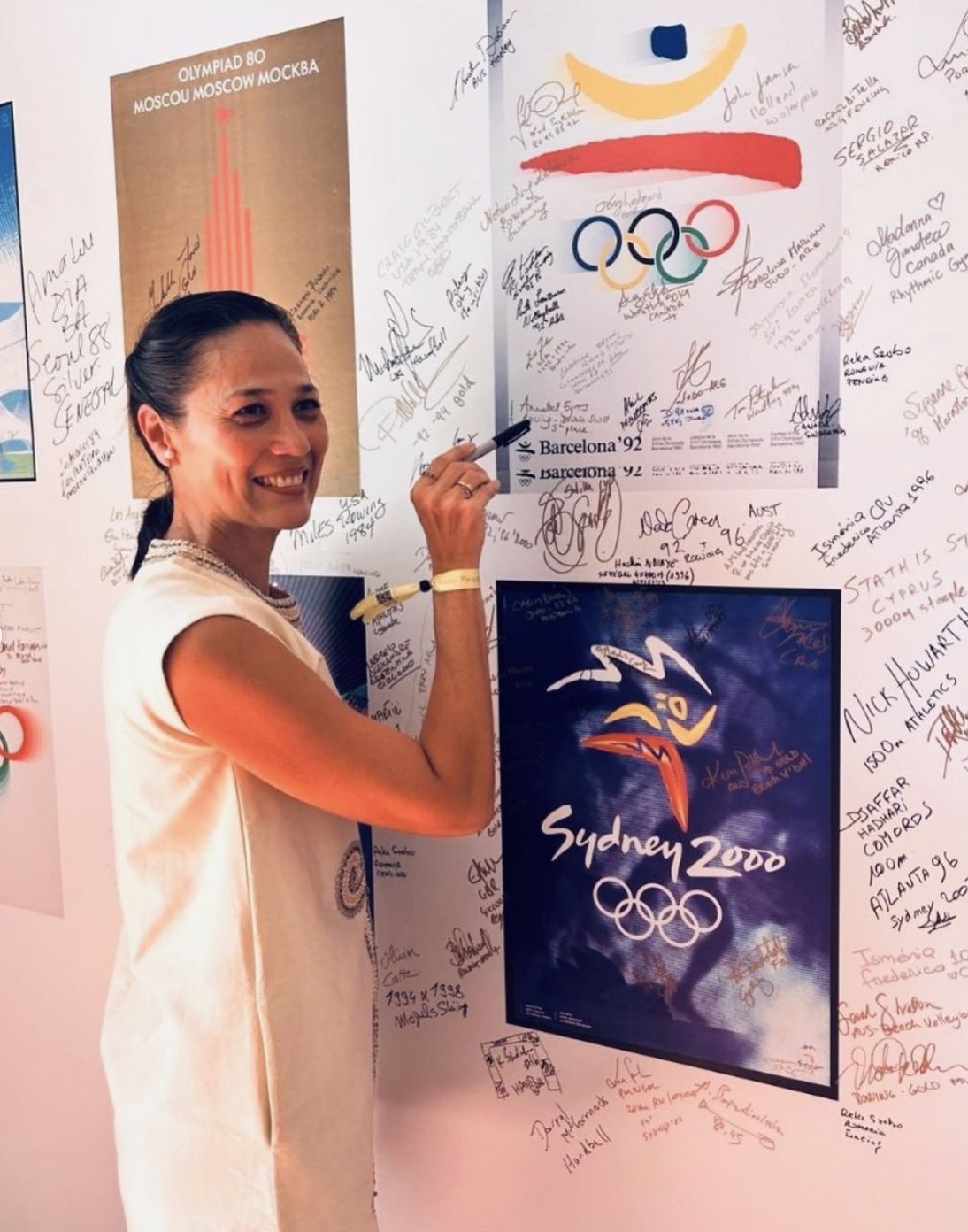Three-time Olympian Akiko Thomson-Guevara posing with her accomplishments (Photo: Julia Fontana)