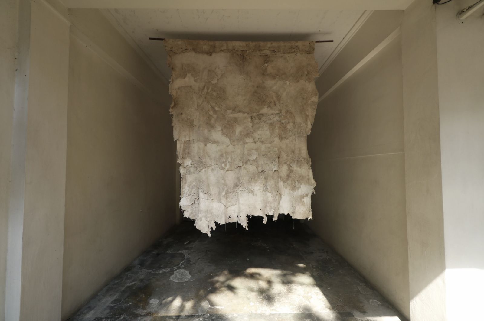 Christina Quisumbing Ramilo’s ‘You don't die in one day, you die slowly’. Canvas eaten by termites, exposed to the elements for over a year then hand sewn back (Photo: Calle Wright)